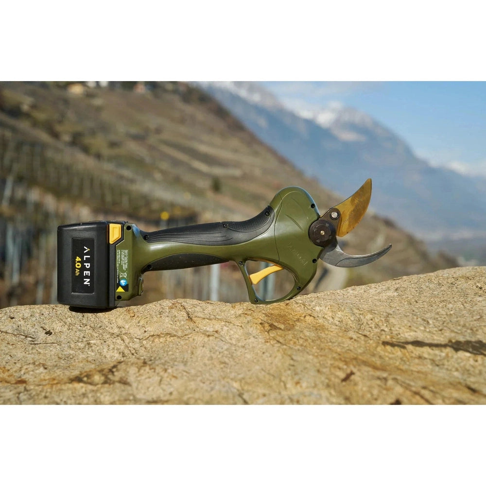 Alpen Electric Pruning Shear Wildhorn A-40 on rocky surface, showcasing high-speed steel blade and durable design.