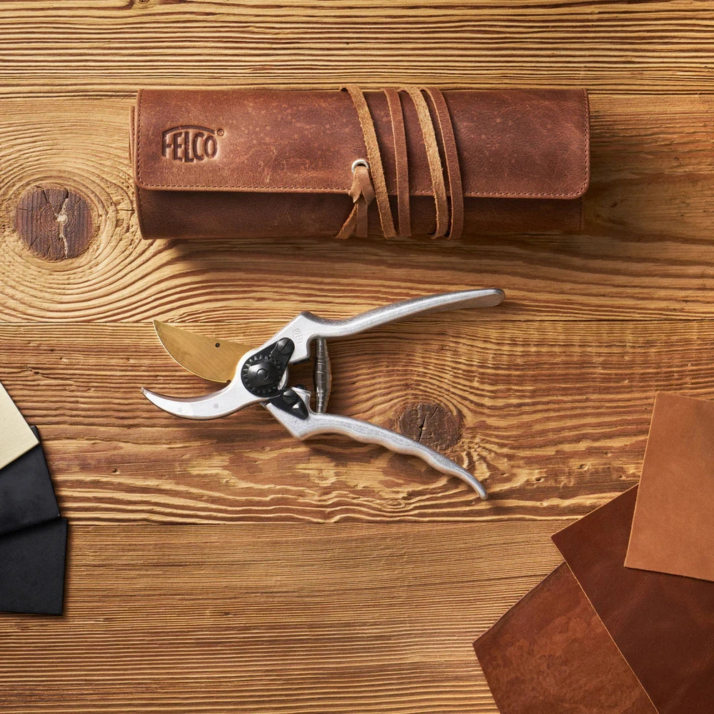 FELCO 2 – 80th Anniversary Special Edition with leather case and leather samples on wooden table